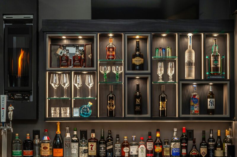 bottles on brown wooden shelf